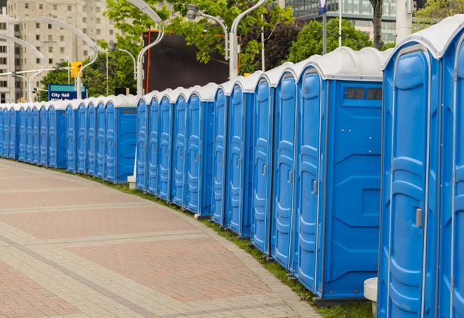 a line of portable restrooms at a sporting event, providing athletes and spectators with clean and accessible facilities in Albany CA